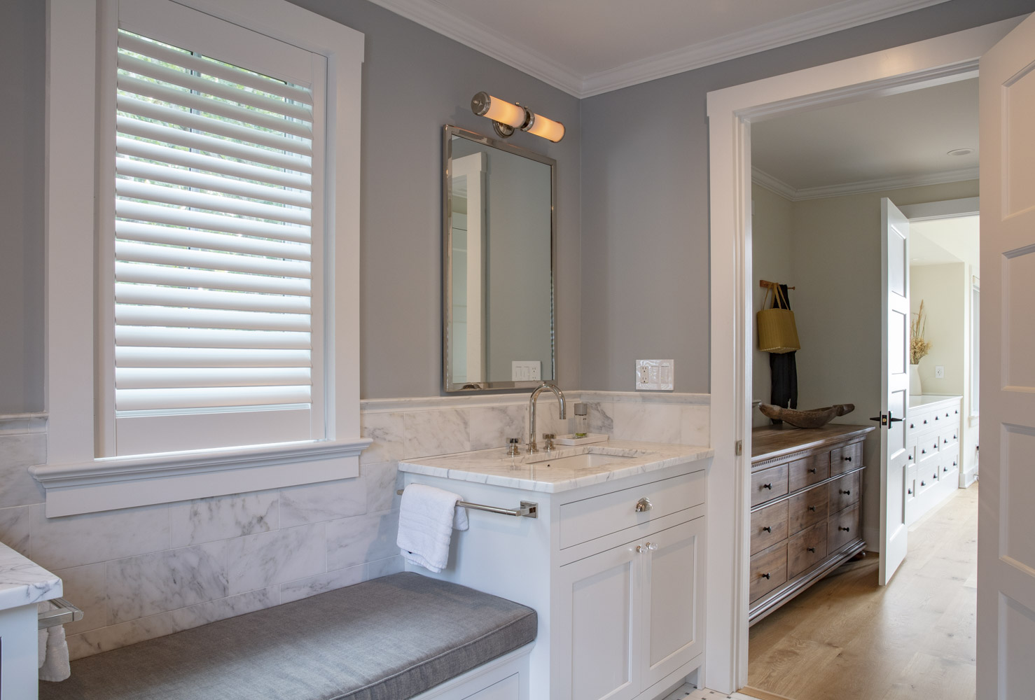 Water Hole blue door welcomes you. Build by Bruce Helier Builders.