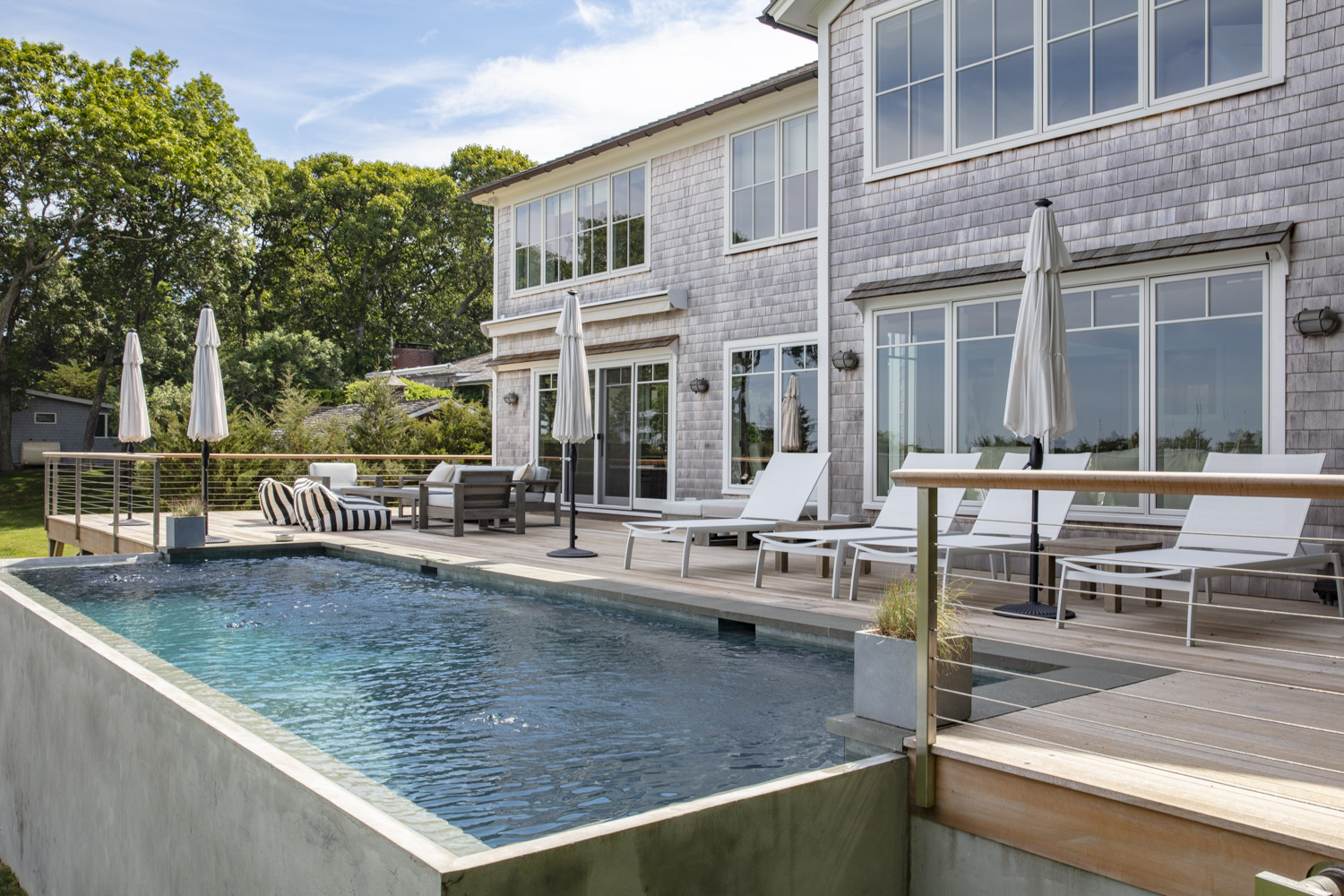 Water Hole blue door welcomes you. Build by Bruce Helier Builders.